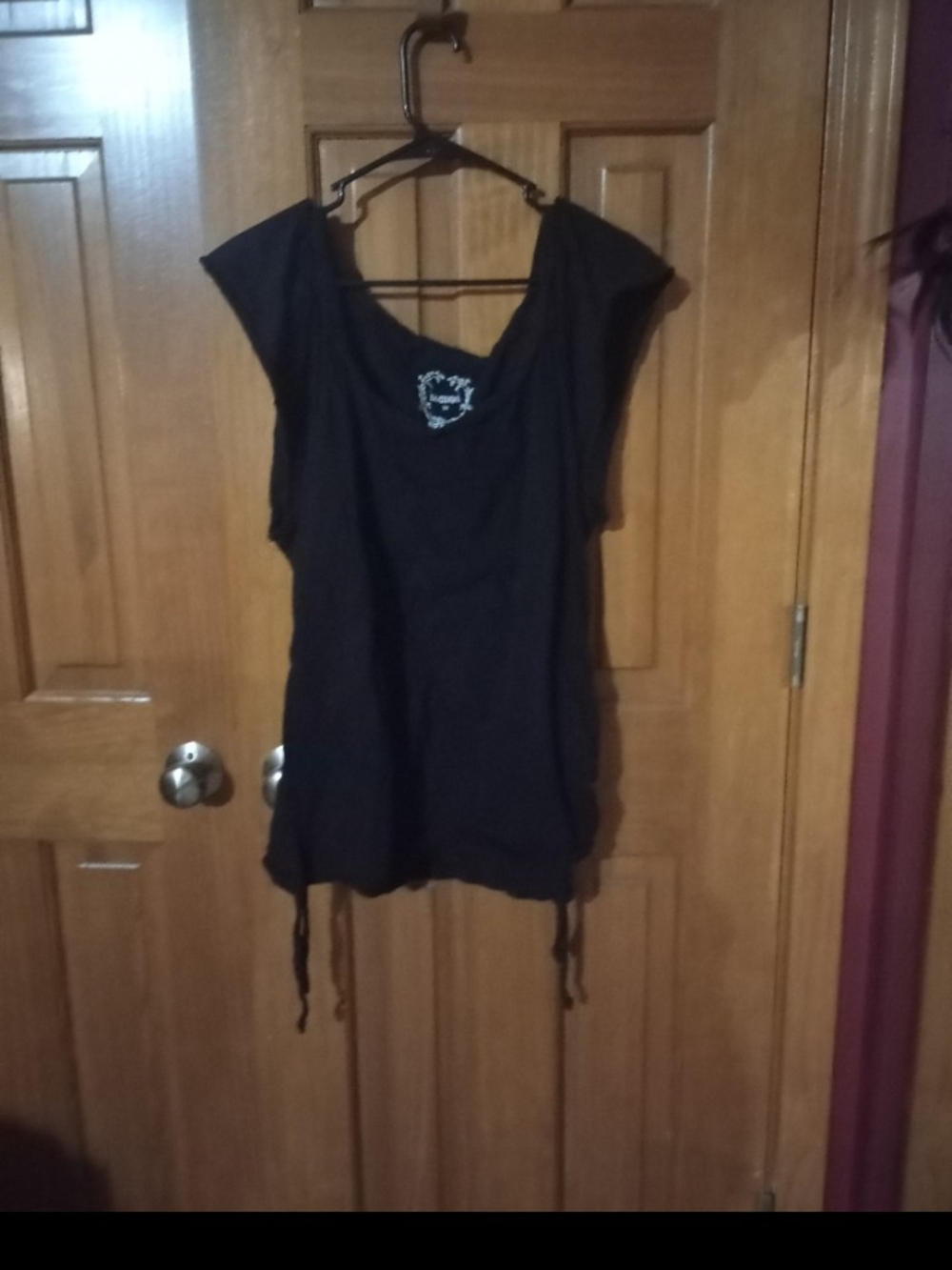 Black Women's Sleeveless Tunic Top with Embellished Neckline